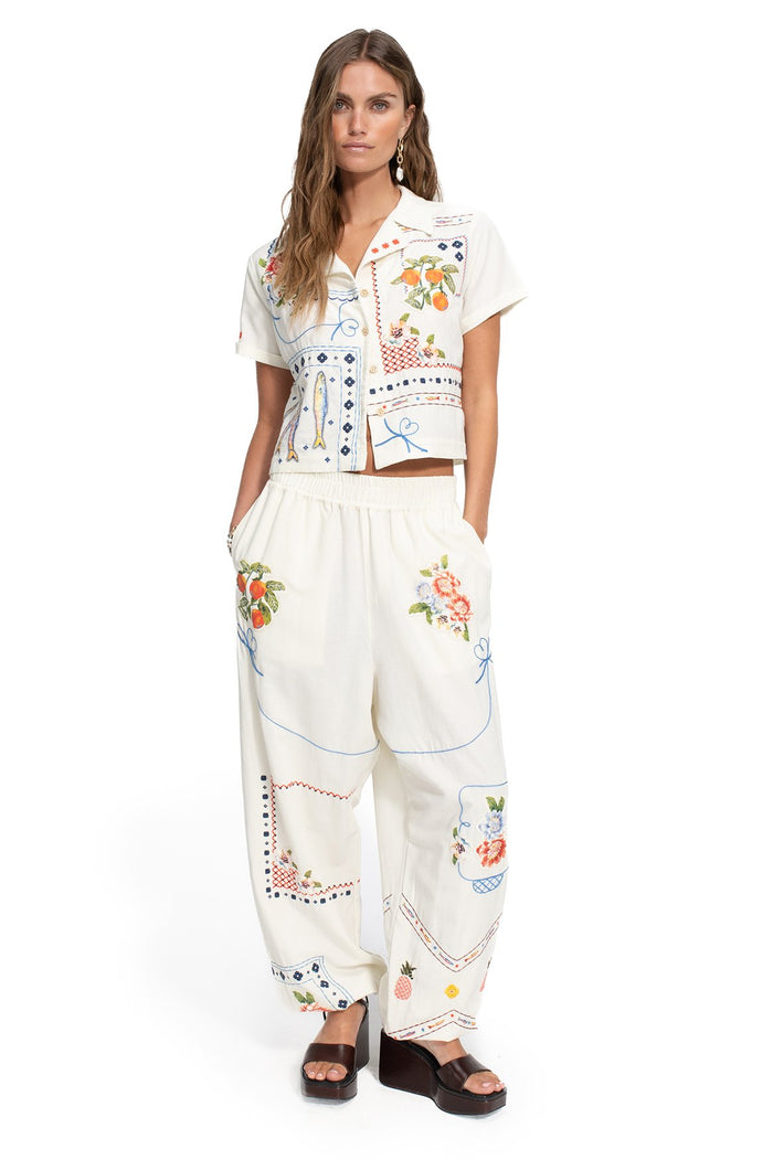 Toscana Pants in off-white with multicolor embroidered fruit, pattern detail and geometric placement print details, elastic waist and cuffs
