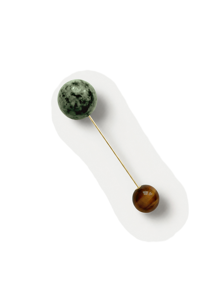 Veronica Beard Gold pin with green and brown stone spheres.