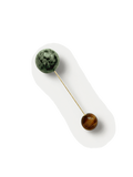 Veronica Beard Gold pin with green and brown stone spheres.