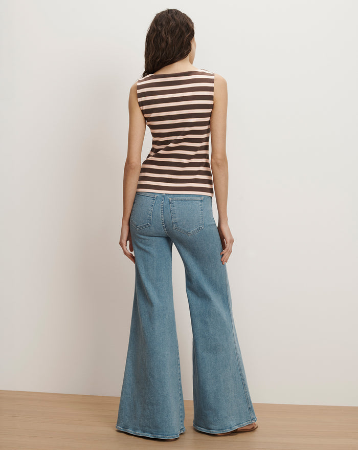Veronica Beard Brown and pink striped sleeveless knit top with light wash flared jeans.