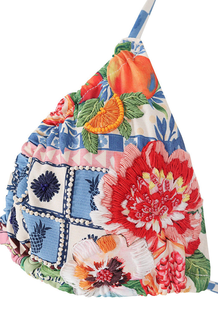 Valle triangle bikini top with embroidered pattern detail and citrus details over blue and white geometric print, featuring pom-pom trim and adjustab…