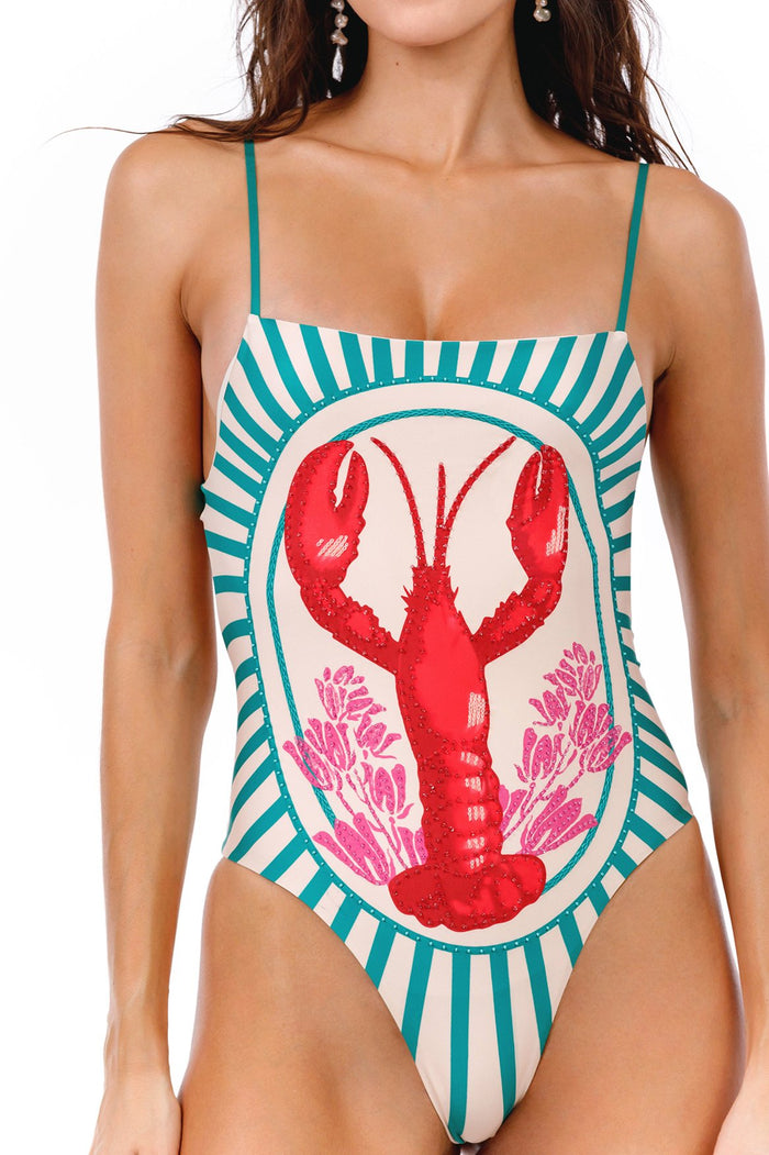 One-piece swimsuit with teal and cream radiating stripes framing a red lobster and pink coral embroidery at center