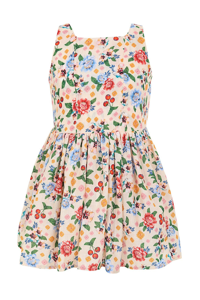 Venus Kids Dress in cream with colorful pattern detail print featuring dahlias, daisies, green leaves, and red cherries, square neckline and gathered…