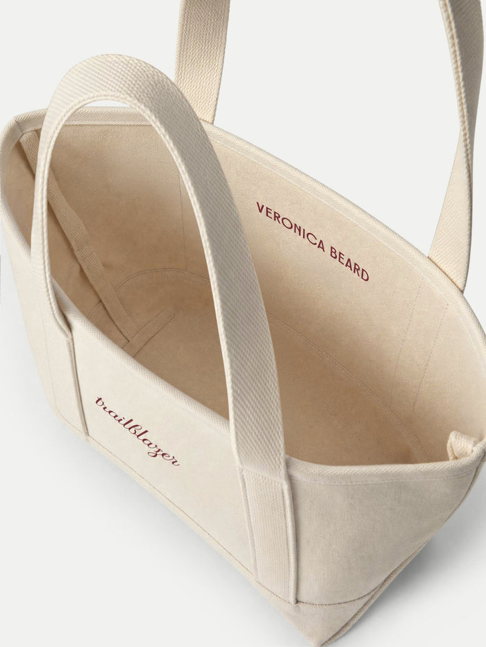 Veronica Beard Beige canvas tote bag with burgundy lettering.