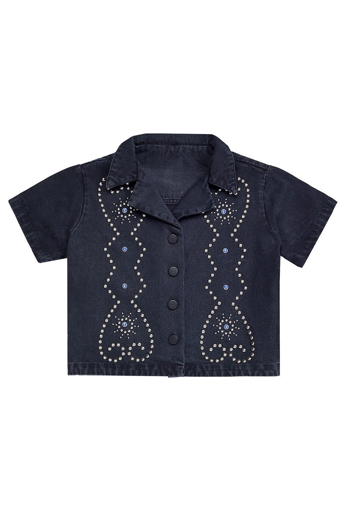 Navy denim cropped shirt with rhinestone and silver stud embellishments forming geometric teardrop patterns, front button closure