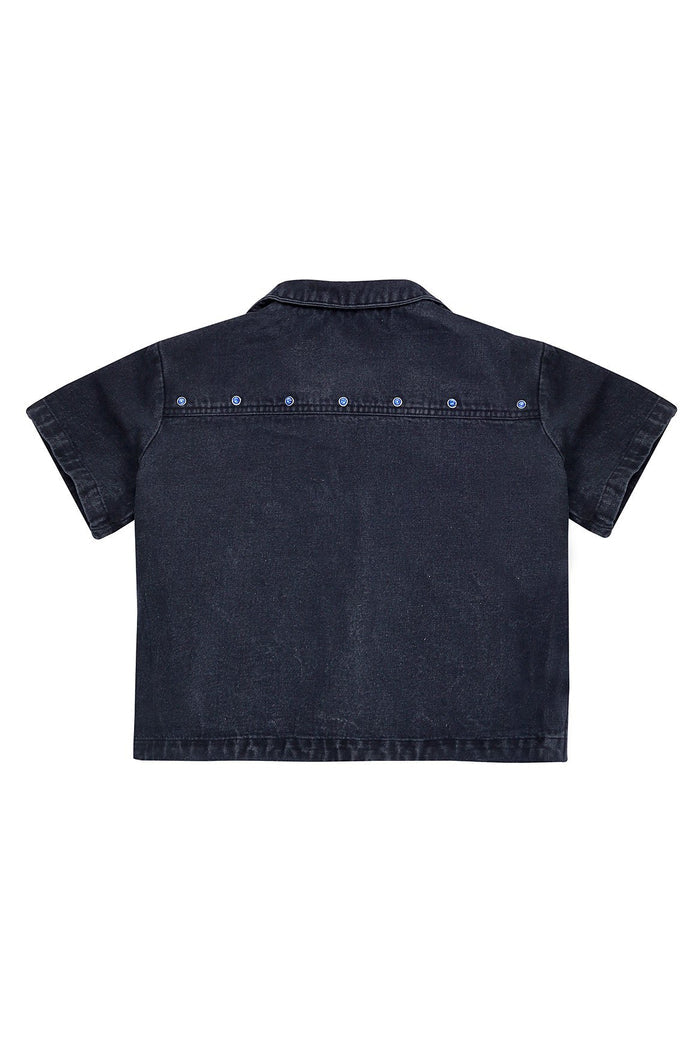 Black denim cropped shirt with rhinestone and silver-tone stud embellishments across yoke, back view